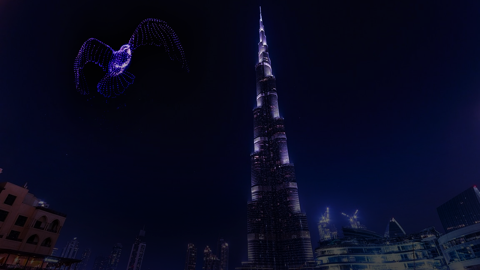 AI drone shows in Dubai lighting up the skyline with synchronized drone formations.
